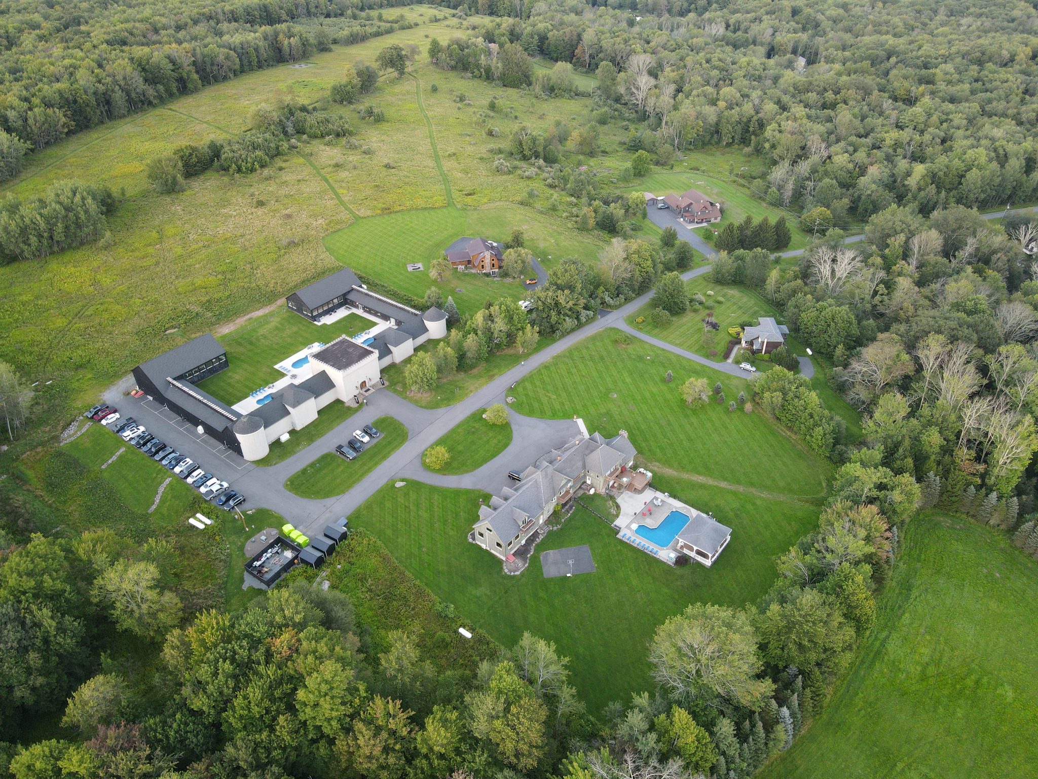 The Castle from the air: the courtyard and pools, the car park along the west wing, and the Mansion across the road